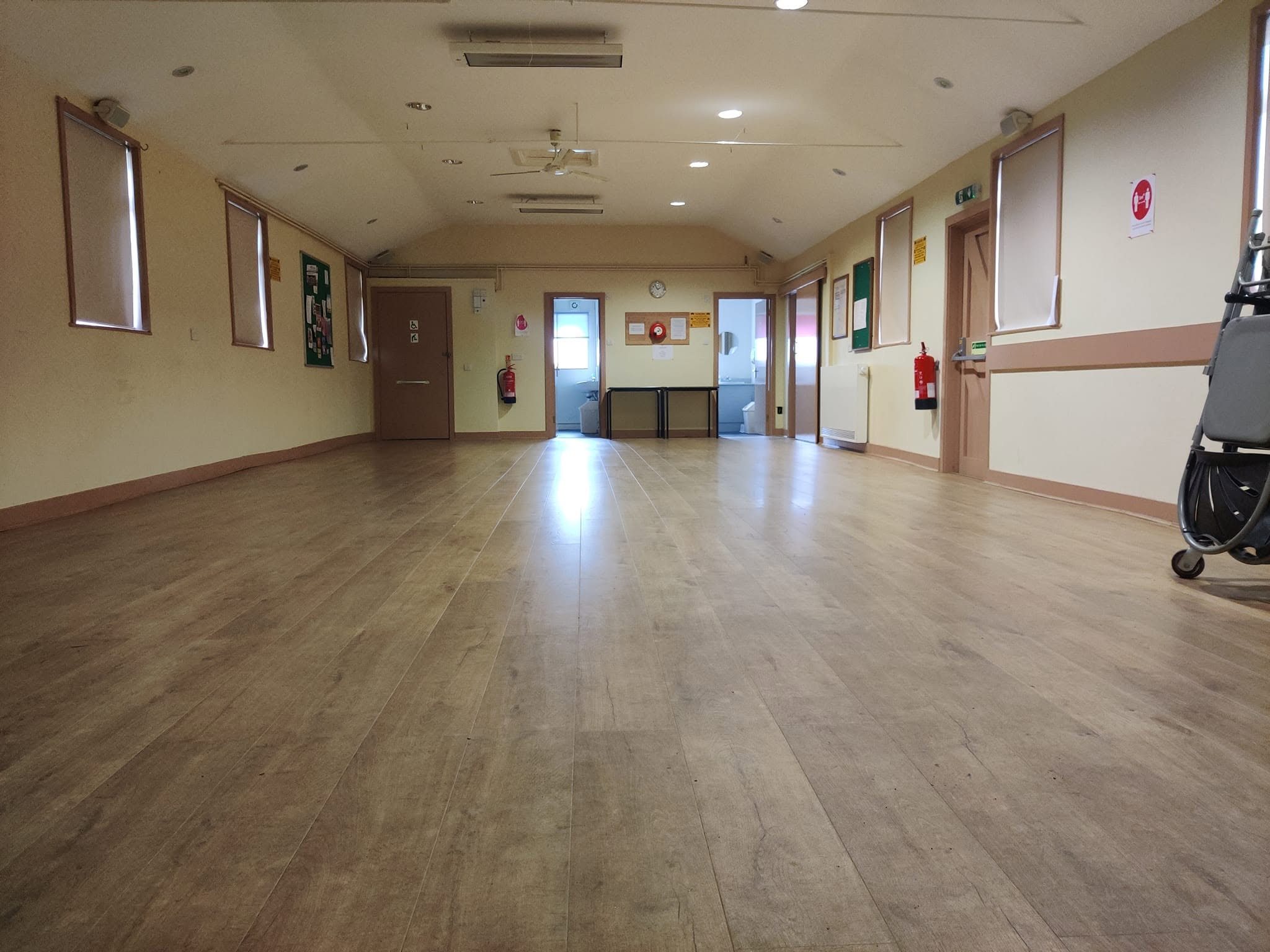 An open view across the main hall and its wooden floor